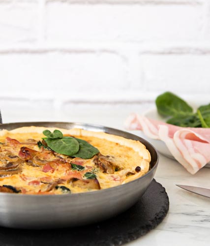 Cooked ham and vegetables quiche